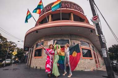 drag queens in front of gay club