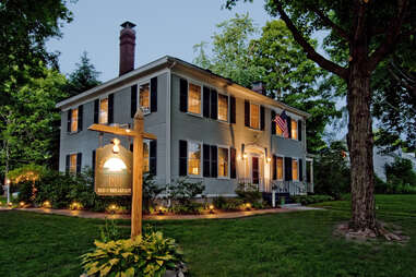 exterior of james fairfield house, lit at dusk, kennebunkport, maine