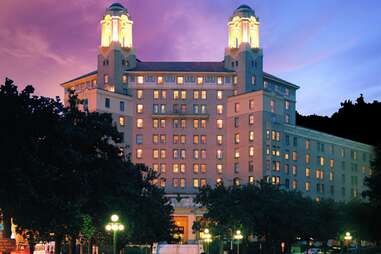 facade of the arlington hotel at sunset