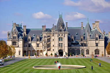 an enormous, castle-like hotel with a fountain