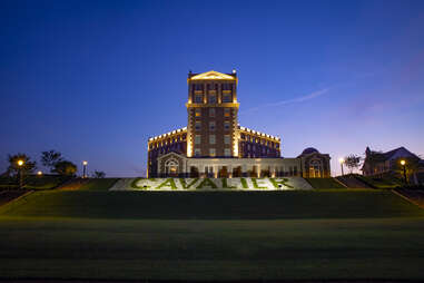 exterior view of cavalier resort lit at night, virginia beach, virginia