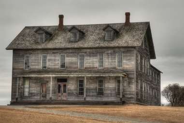 a creepy abandoned wooden mansion