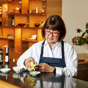 Jane Matsumoto pouring soy sauce at MISE at JACC in Little Tokyo