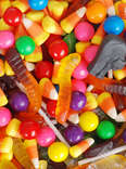 A pile of assorted Halloween candy, including candy corn. 