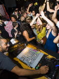 dj spinning to a packed crowd in manchester uk